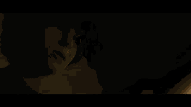 a person is standing in a dark room with a ceiling that is missing