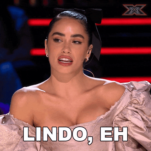 a woman says lindo eh while wearing a dress