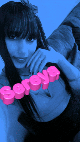a woman with a ring on her finger and the name soraya on her chest