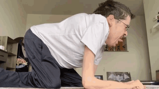 a man is doing a plank while wearing a t-shirt that says san francisco triathlon