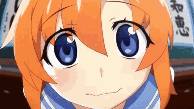 a close up of a cartoon character with orange hair and blue eyes .