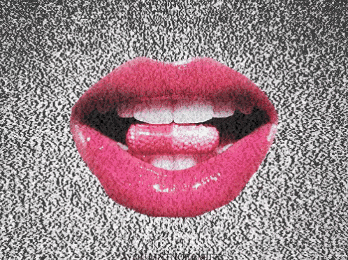 a close up of a woman 's lips with a pill sticking out