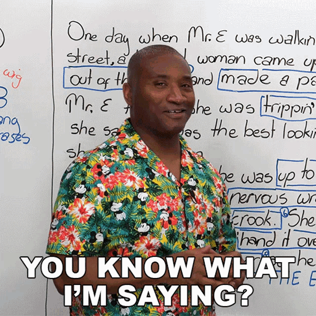 a man in a hawaiian shirt stands in front of a whiteboard that says one day when mr. e was walking