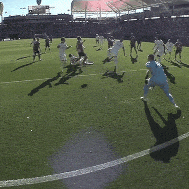 a soccer player in a blue jersey with the number 1 on it jumps in the air to catch a ball
