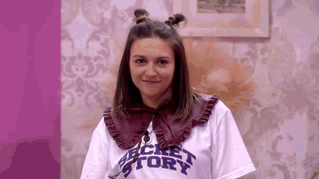 a woman wearing a t-shirt that says secret story on it