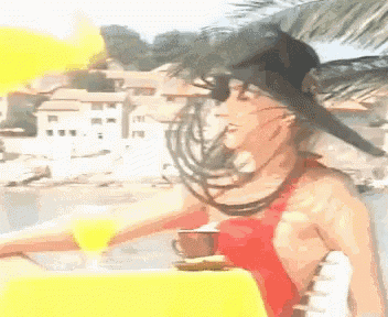 a woman in a red top is holding a cup of coffee and a glass of orange juice