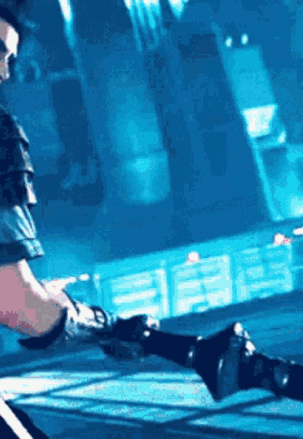 a man is playing a video game with a prosthetic arm