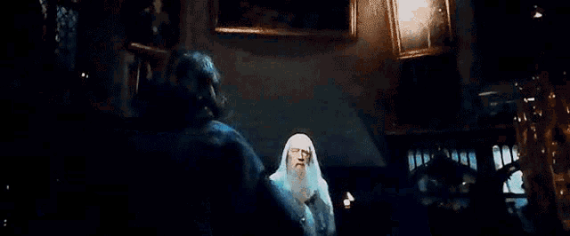 a ghost is flying through the air in a dark room with a light coming out of it .