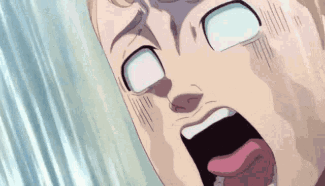 a close up of a man 's face with his mouth open and his tongue sticking out