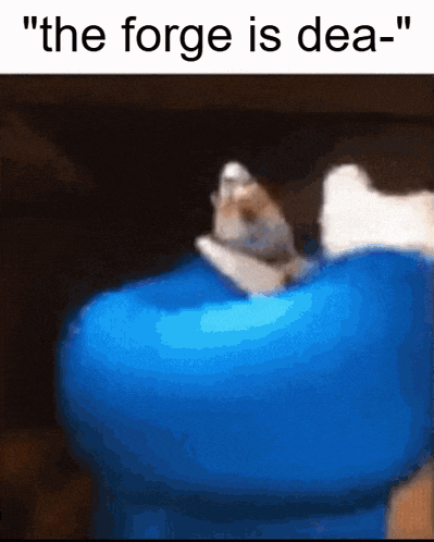 a cat is laying on a blue object with the words " the forge is dea "