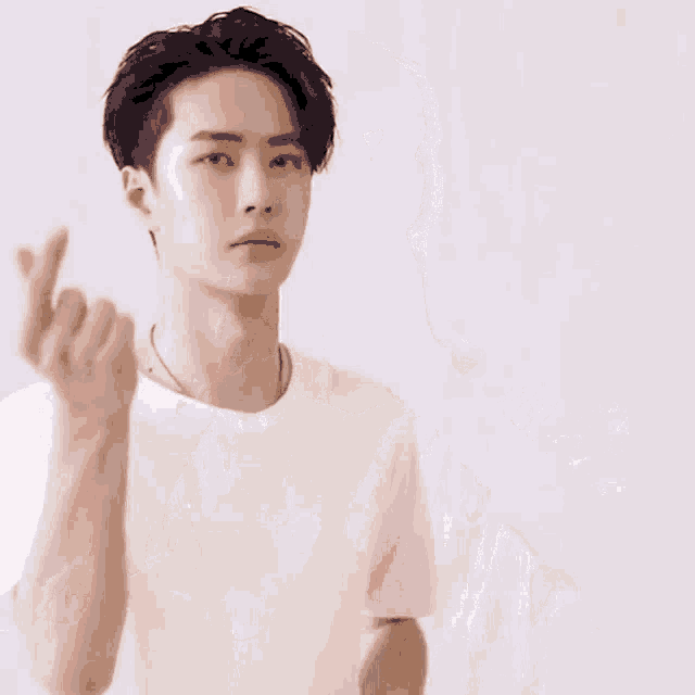 a blurry picture of a person 's face with their hands