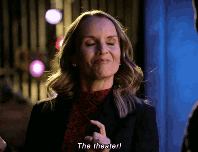 a woman says " the theater " while making a funny face