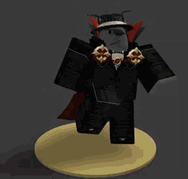 a roblox character wearing a black suit and red cape is standing on a yellow base .