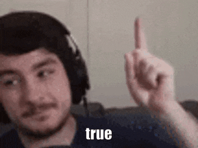 a man wearing headphones is giving the middle finger .