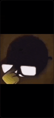 a yellow smiley face with glasses and a smile on it