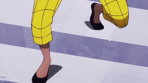 a person wearing yellow plaid pants and black shoes is crossing a street