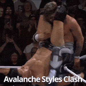a couple of men are wrestling in a ring and one of them is holding the other 's leg .