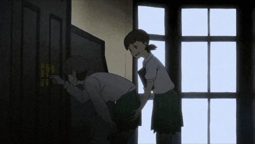 two girls are looking at a door that says exit