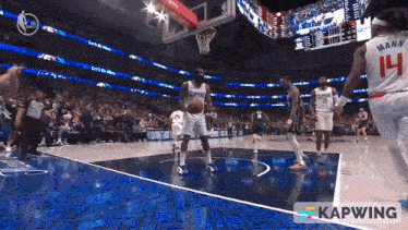 a player with the number 14 on their jersey is playing basketball