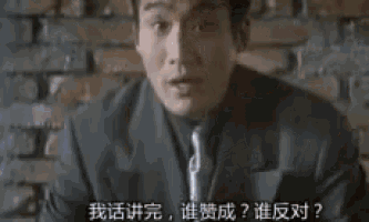 a man wearing glasses is talking in chinese .