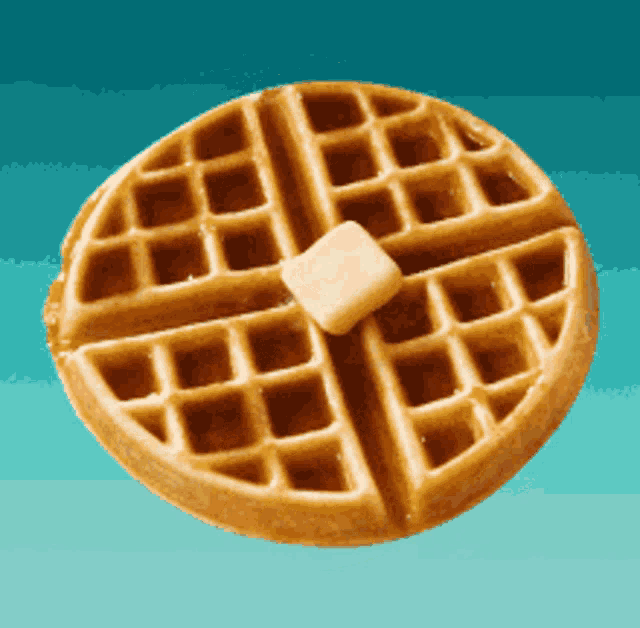 a waffle with a slice of butter on top