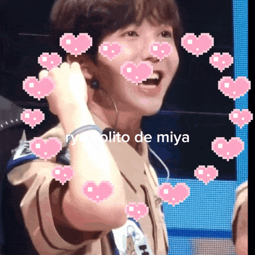 a pixelated image of a person with pink hearts around their face and the words " rycolito de miya " at the bottom