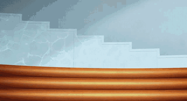 a set of stairs leading up to a pool with a wooden bench in front of them
