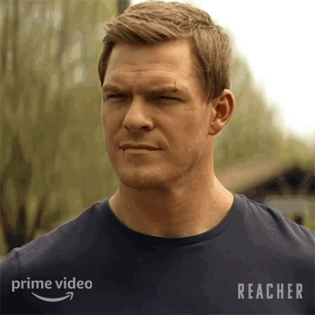 a man is wearing a blue shirt that says prime video