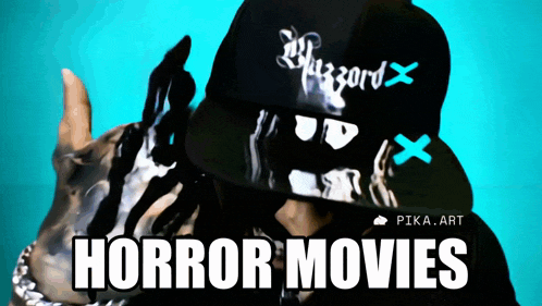 a person wearing a black hat with the words horror movies written on it