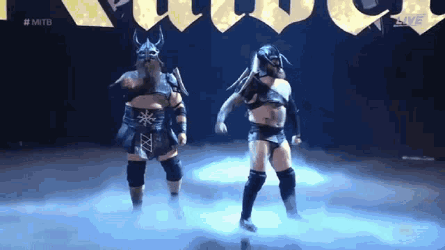 two wrestlers are standing in front of a sign that says #mitb