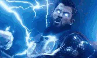 thor is being struck by lightning in a movie scene from avengers : age of ultron .