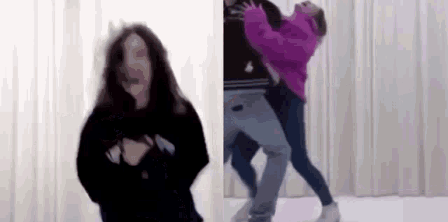 a woman is dancing with a man and a woman in a room .