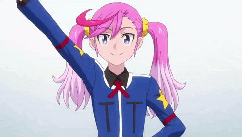 a girl with pink hair is wearing a blue jacket with the letters tt on it