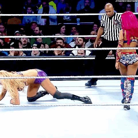 a woman in a wrestling ring with the hashtag #thenextbigthing on the bottom right