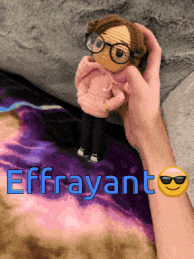 a person holding a doll with the name effrayant