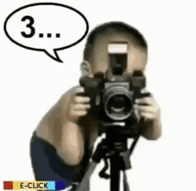 a little boy is taking a picture with a camera with a speech bubble that says 3