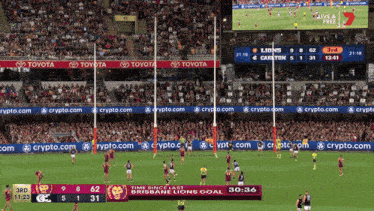a toyota ad is on the side of a sports field
