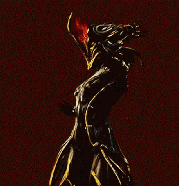 a statue of a demon with a red light on her head .
