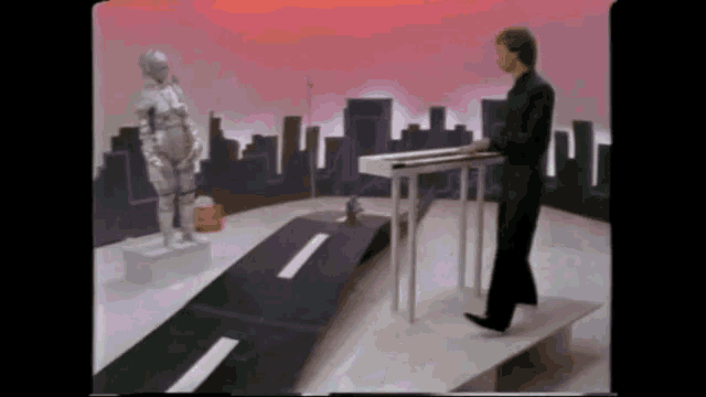 a man in a suit is playing a piano in front of a city skyline