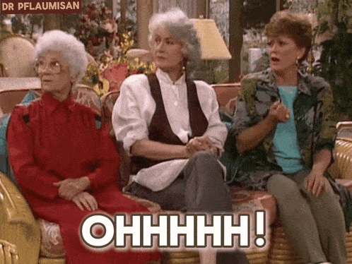 three older women are sitting on a couch and one of them is saying ohhhh