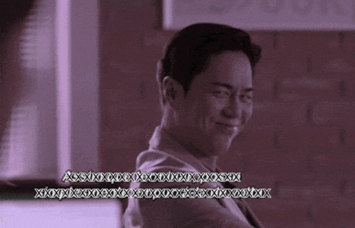 a man in a suit is smiling with a purple background that says xyz