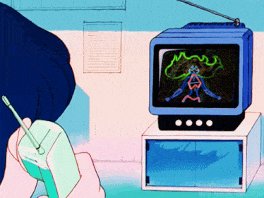 a person is holding a cell phone in front of a tv screen