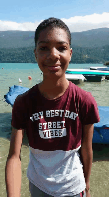 a boy wearing a very best day street vibes t-shirt