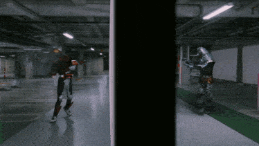 a man in a robot costume is standing in a dark room
