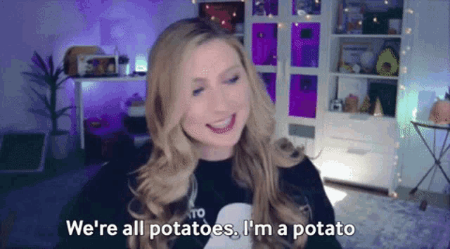 a woman is smiling and saying we 're all potatoes . i 'm a potato .