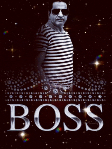 a man in a striped shirt is standing in front of a poster that says boss