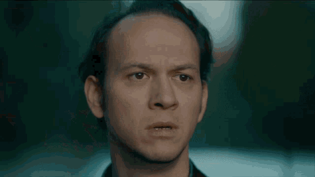 a man with a very serious look on his face