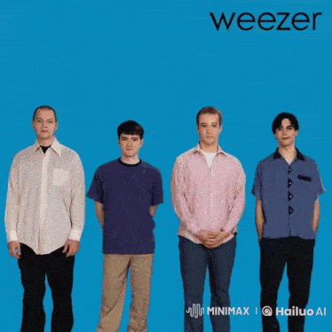 a group of people holding brooms in the air with the word weezer behind them