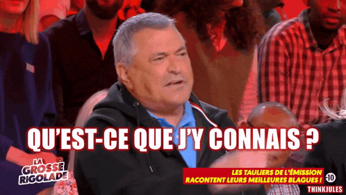 a man in a crowd with the words qu 'est-ce que j'y connais