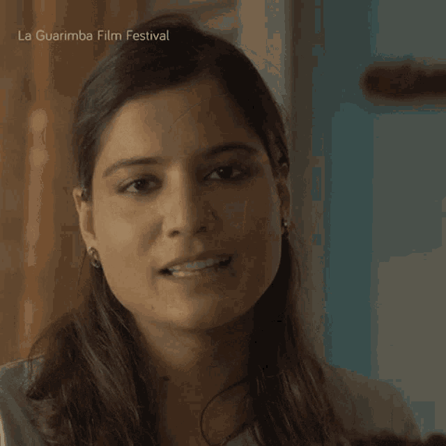 a close up of a woman 's face with the words la guarimba film festival written above her